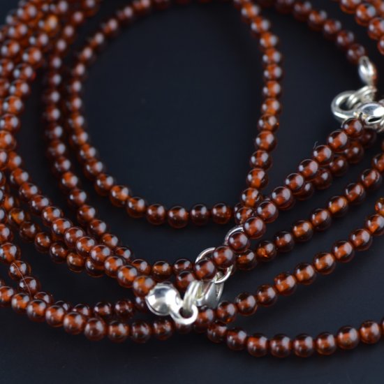 Long amber necklace from round cherry amber beads